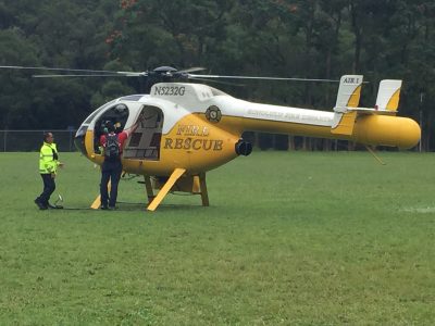 When is it appropriate to call 911 for a rescue while hiking?